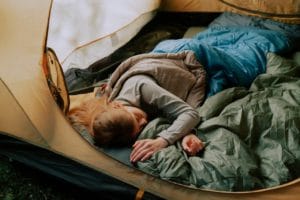 Person Sleeping In A Camping Tent
