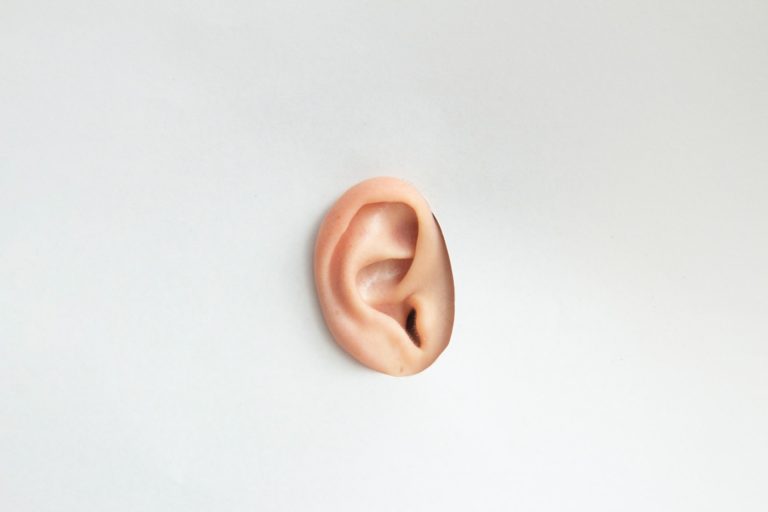 Ear showing through a hole
