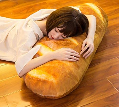 Person sleeping on giant bread pillow