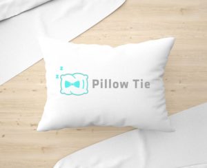 Pillow Tie logo printed on a sleeping pillow
