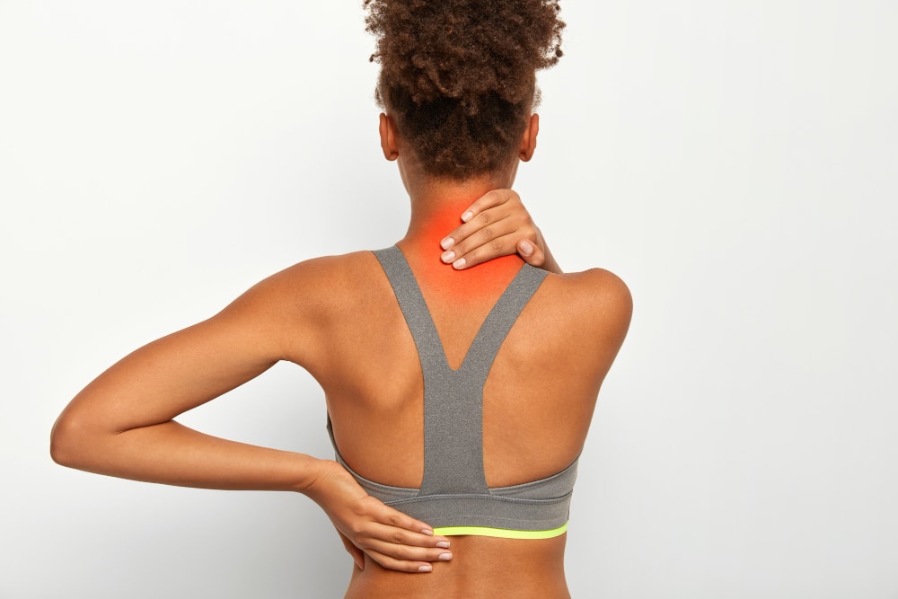Woman holding her neck because of back pain