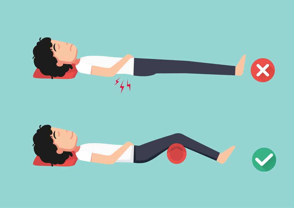 Illustration of person putting pillow under knees while laying on his back